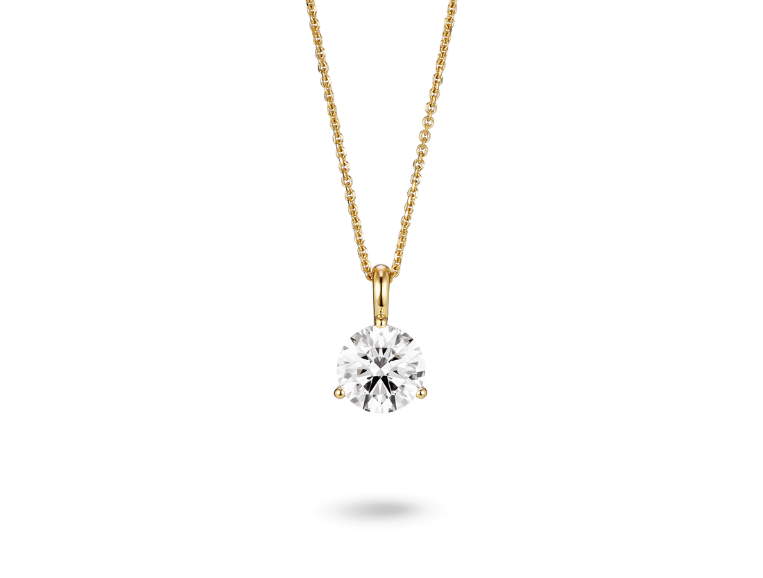 Front view of a lab-grown 1.5 carat round brilliant solitaire on a bale pendant in yellow gold