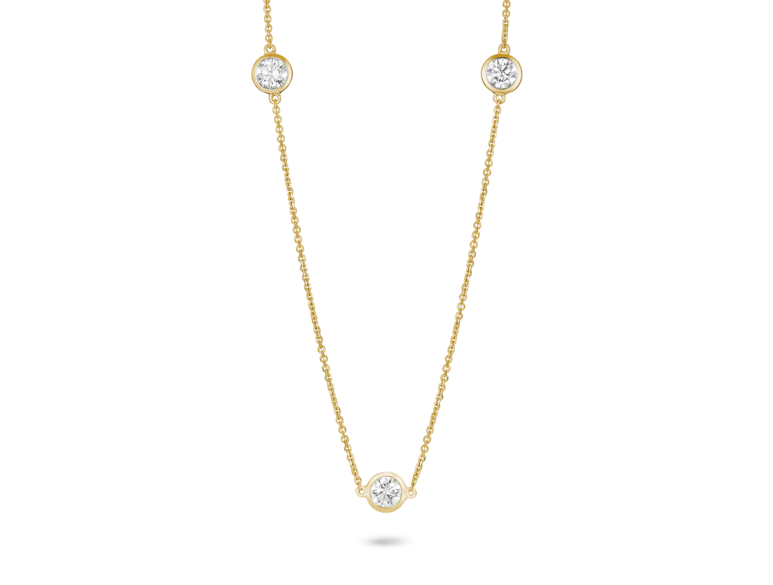 Front shot of 0.75 carat station necklace in 14k yellow gold