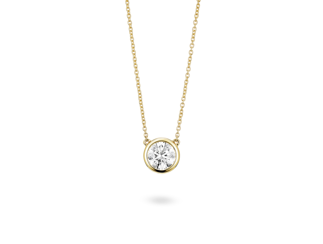 Front view of 1 carat round brilliant bezel pendant in 14k yellow gold