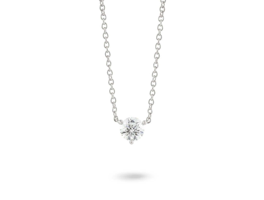 Front view of a white 0.5 carat round brilliant solitaire pendant in 14k white gold